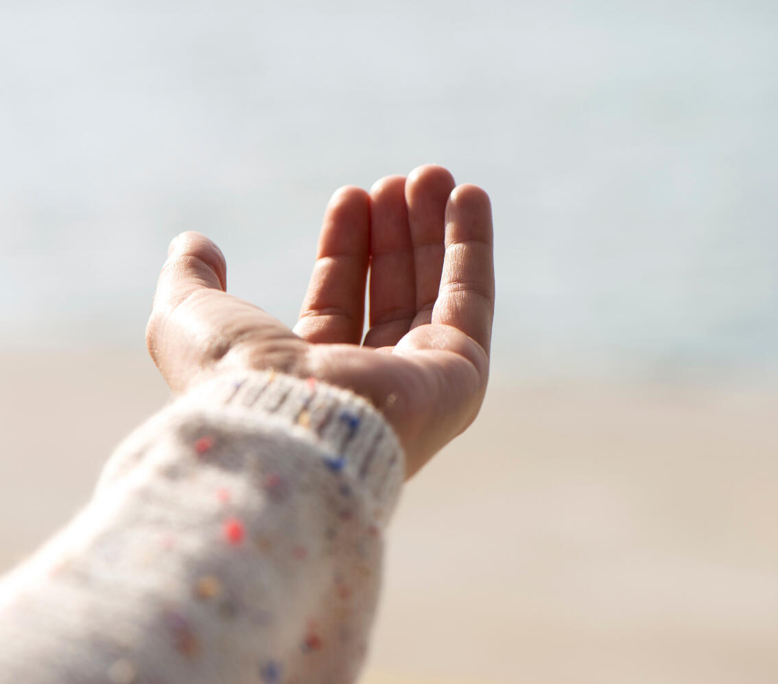Open Hand Gesture for Somatic Healing and Nervous System Support Outstretched hand offering healing and nervous system regulation through SoulPosture™ methods